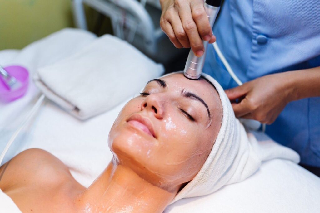 women takes anti aging facial
