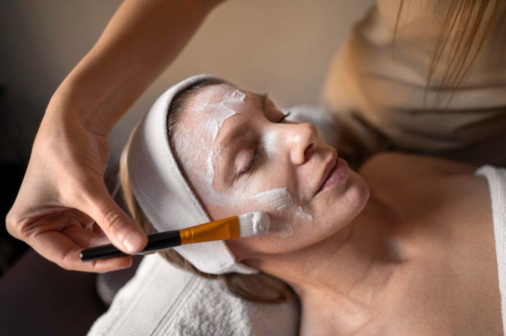 women takes anti aging facial