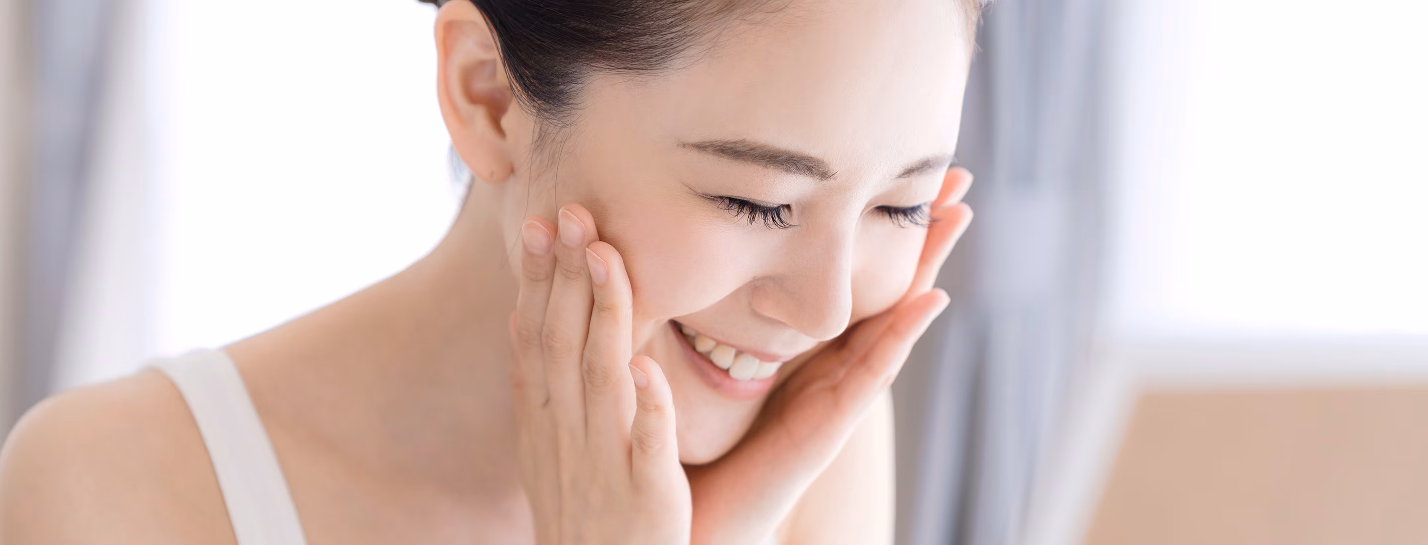 Close-up of woman with healthy radiant skin